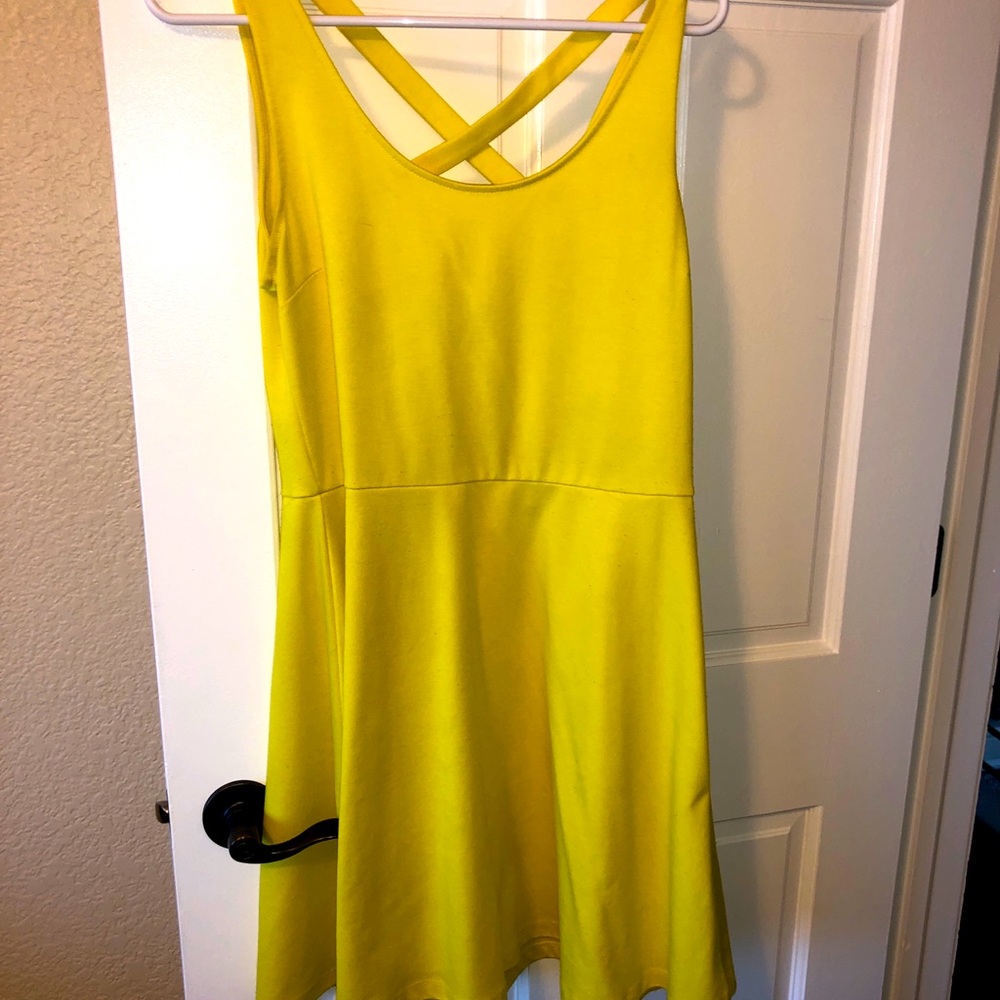 Yellow summer dress with cross cross back.
